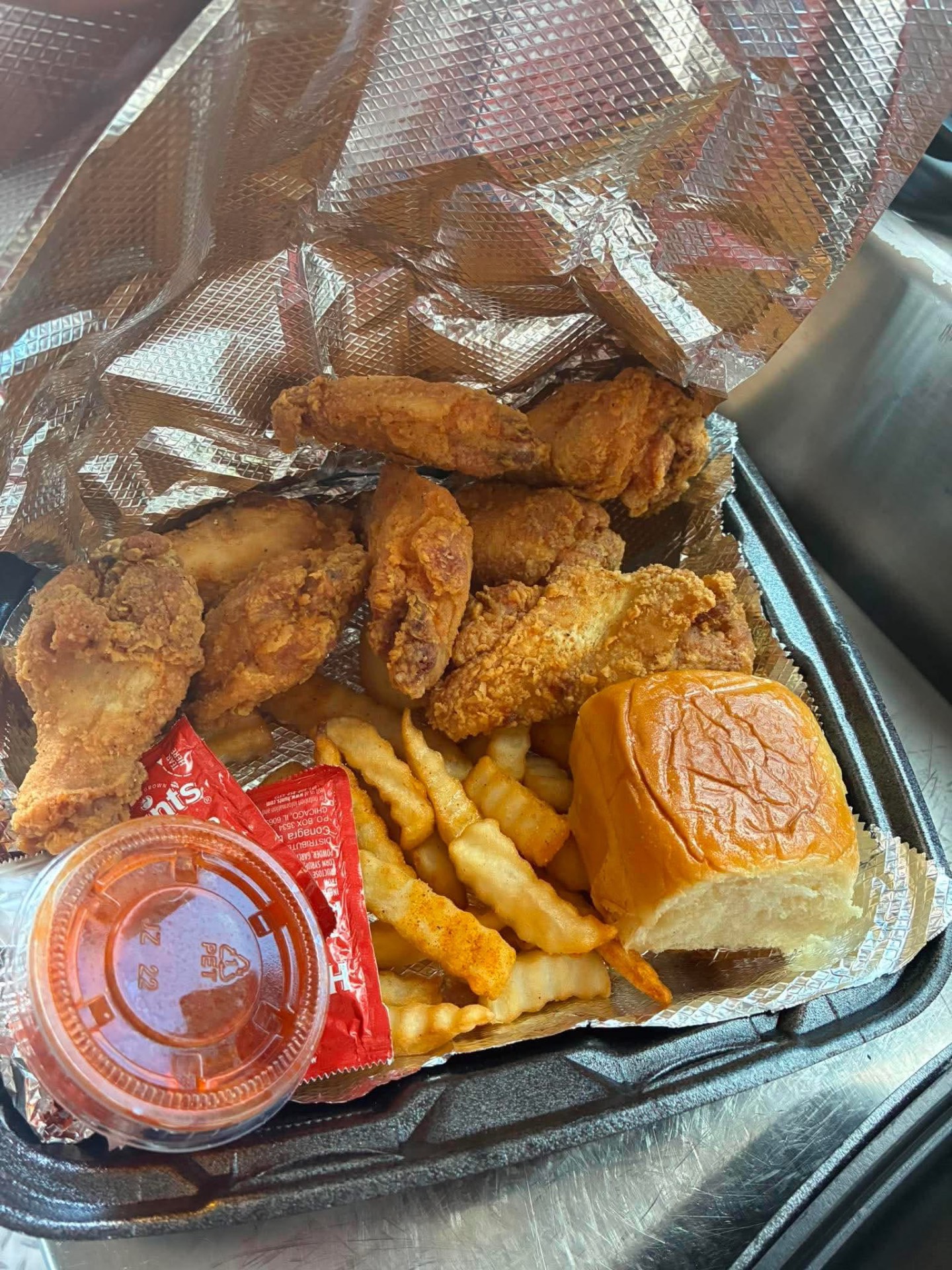 Fried chicken basket with crinkle fries and a roll from Tae Bae Eatz